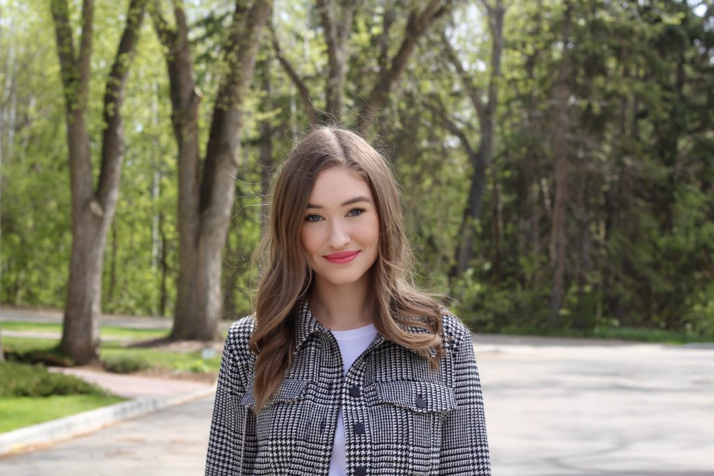 headshot of Taylor smiling